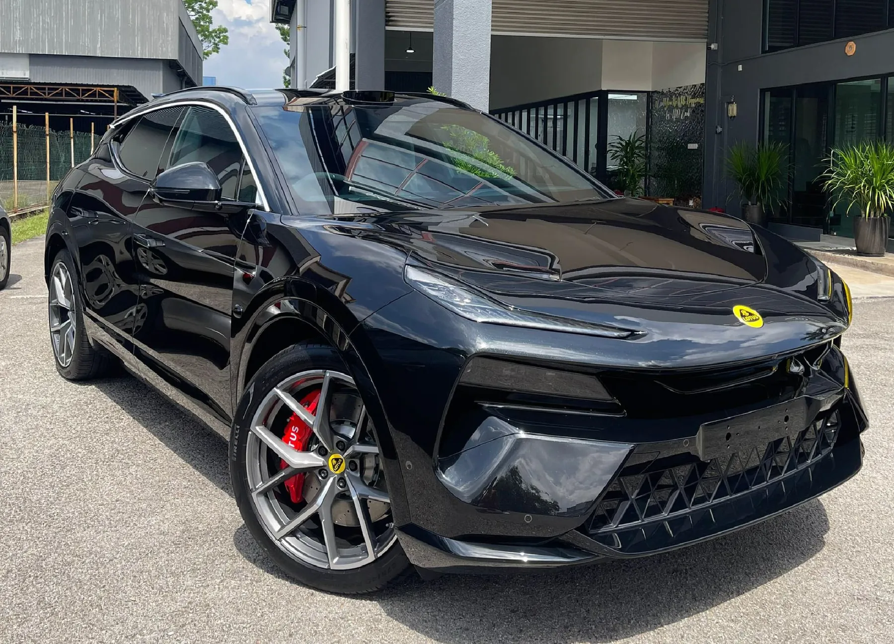 Black car with protection film fitted, outside the studio